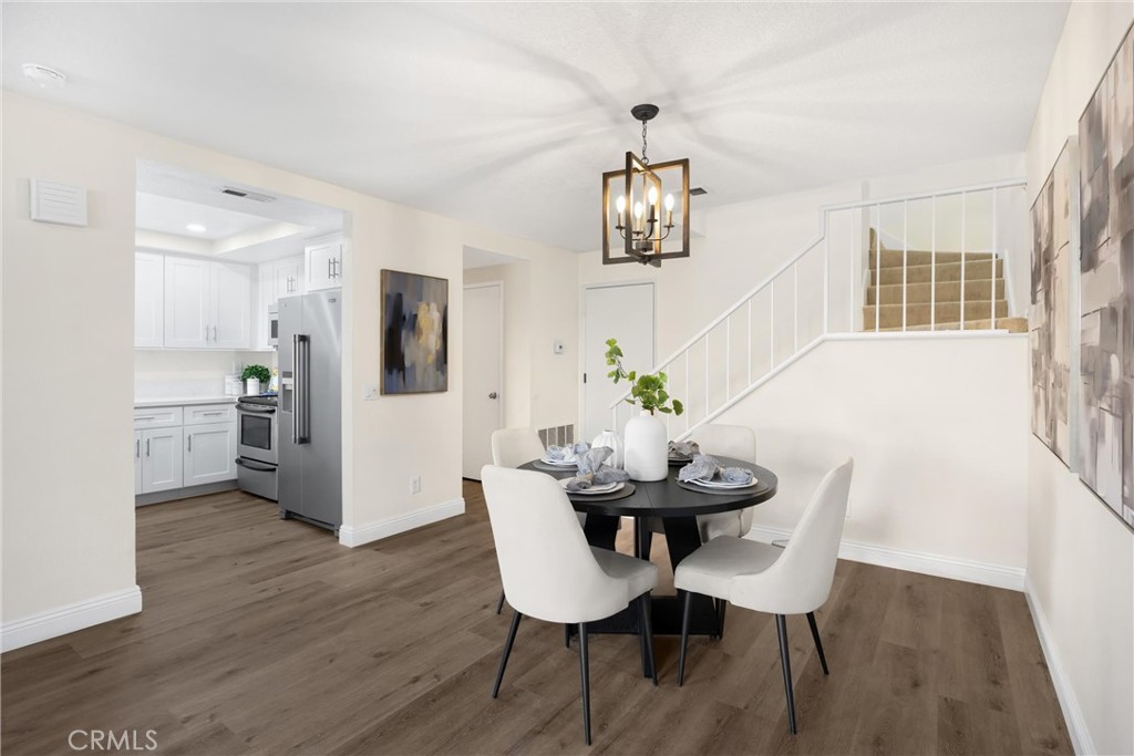 7268 Hermosa Avenue Rancho Cucamonga, CA 91701 - Photo 20 of 50 a view of a dining room with furniture and wooden floor