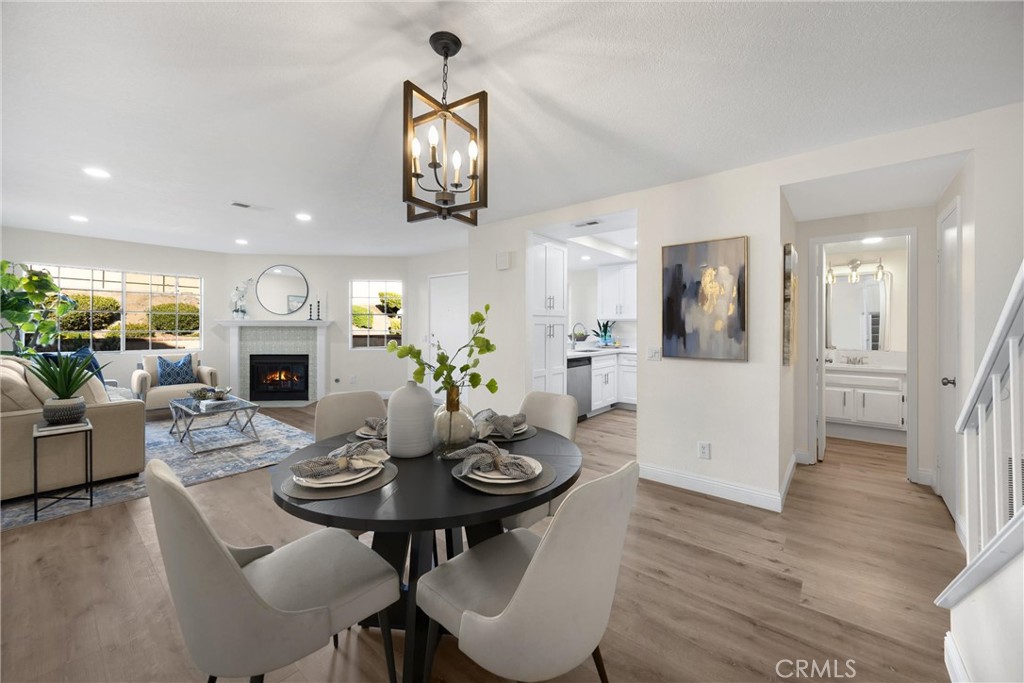 7268 Hermosa Avenue Rancho Cucamonga, CA 91701 - Photo 21 of 50 a view of a dining room with furniture and wooden floor