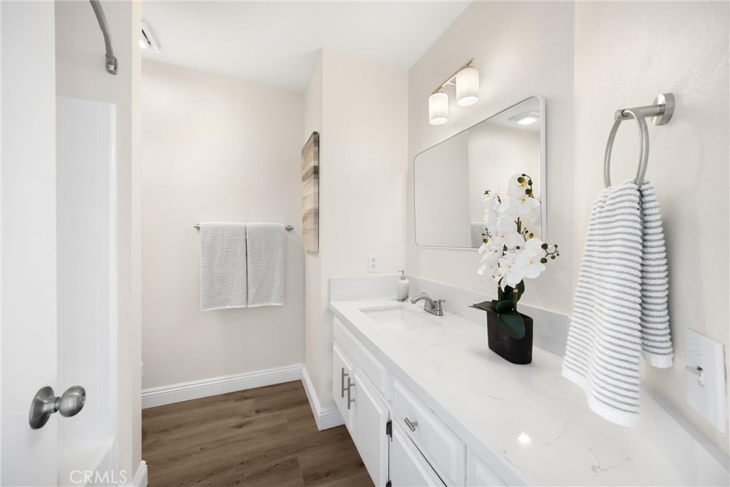 7268 Hermosa Avenue Rancho Cucamonga, CA 91701 - Photo 27 of 50 a bathroom with a sink a mirror and vanity