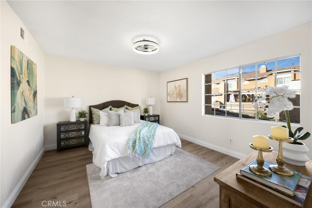 7268 Hermosa Avenue Rancho Cucamonga, CA 91701 - Photo 29 of 50 a living room with a bed furniture and next to a window