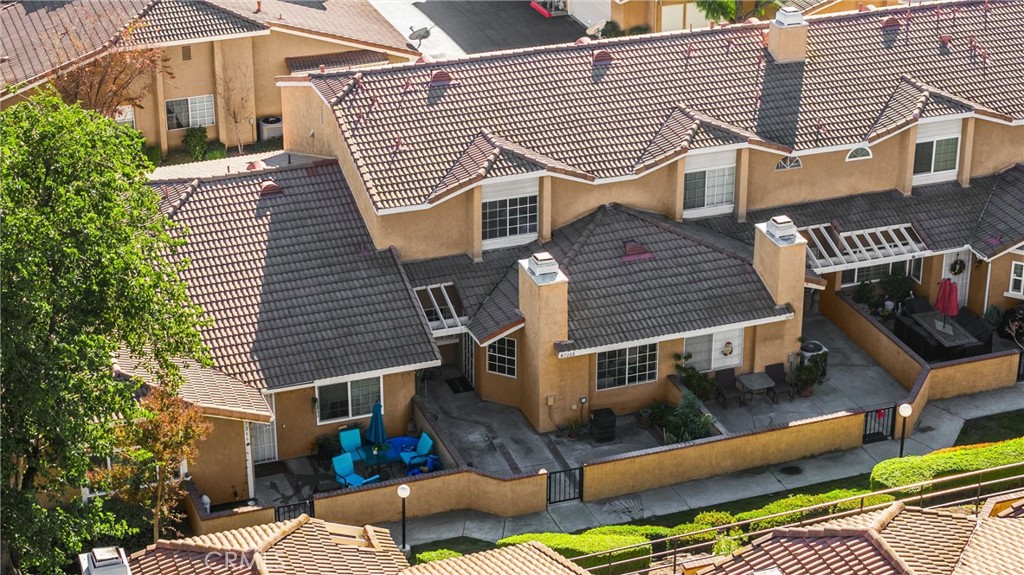 7268 Hermosa Avenue Rancho Cucamonga, CA 91701 - Photo 36 of 50 a view of a house with a bed and a lounge chair