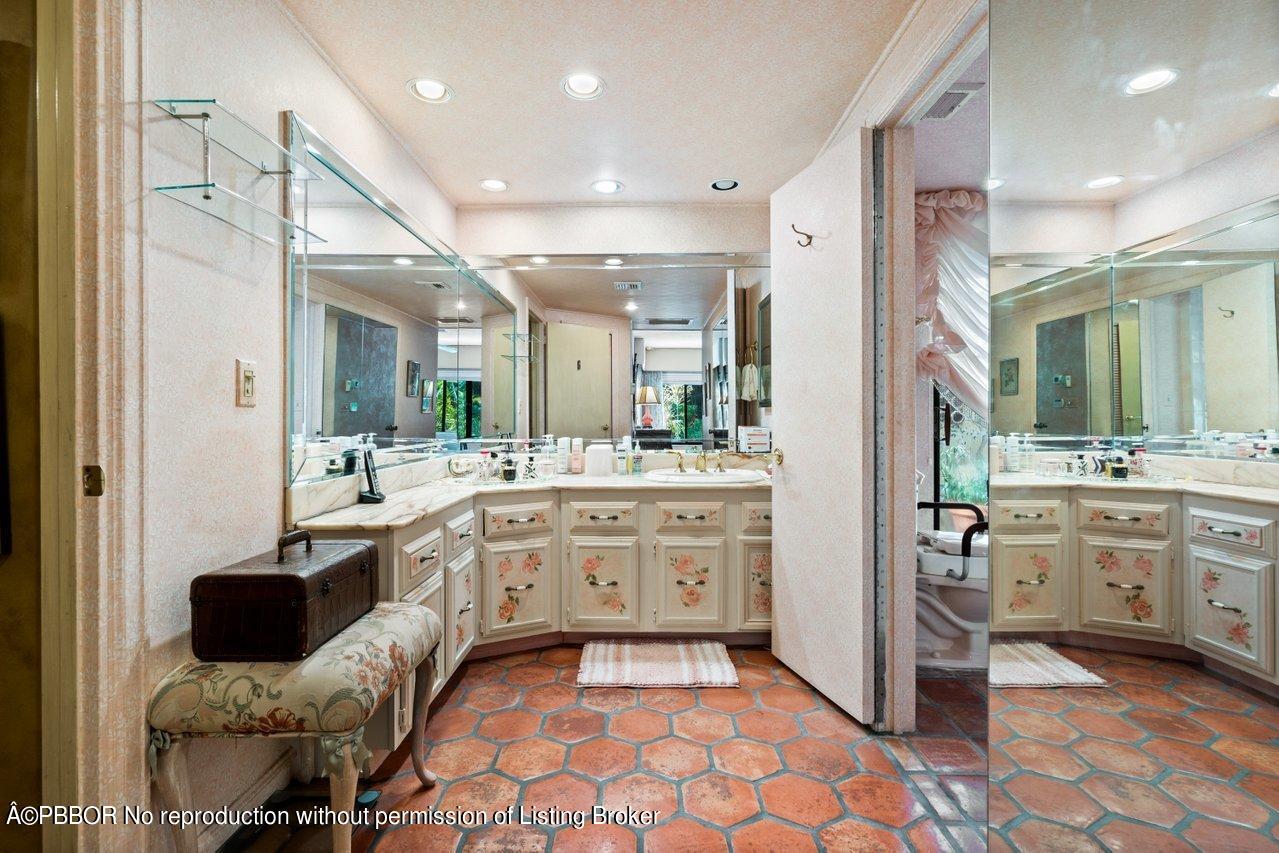 2 Little Pond Road, Unit 1 Lantana, FL 33462 - Photo 14 of 26 a large bathroom with a sink mirror and a bath tub