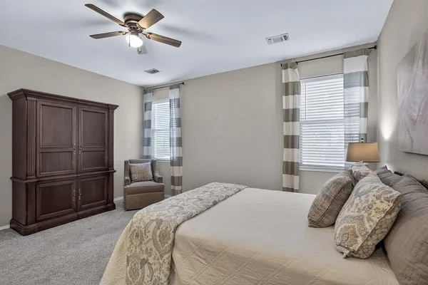 a bathroom with a tub double sink and mirror