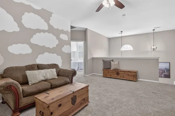 a living room with furniture and a window