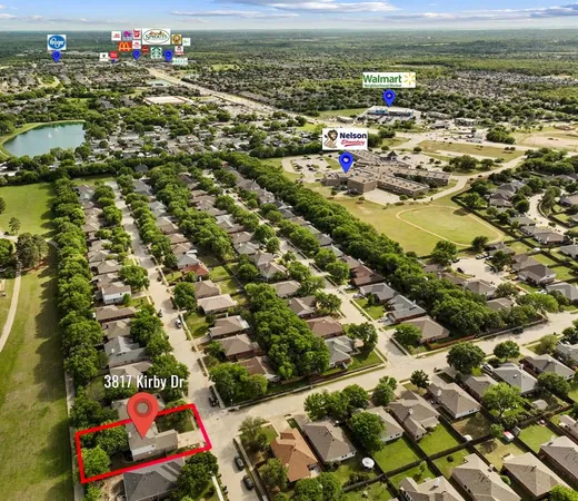 an aerial view of residential houses with outdoor space and swimming pool