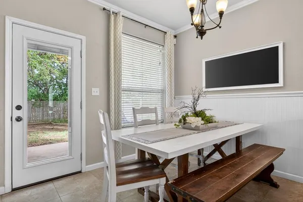 a living room with stainless steel appliances kitchen island granite countertop furniture and a flat screen tv
