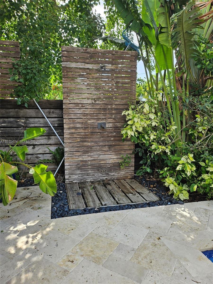 2230 Northwest 17th Avenue Homestead, FL 33030 - Photo 21 of 31 a backyard of a house with plants and trees