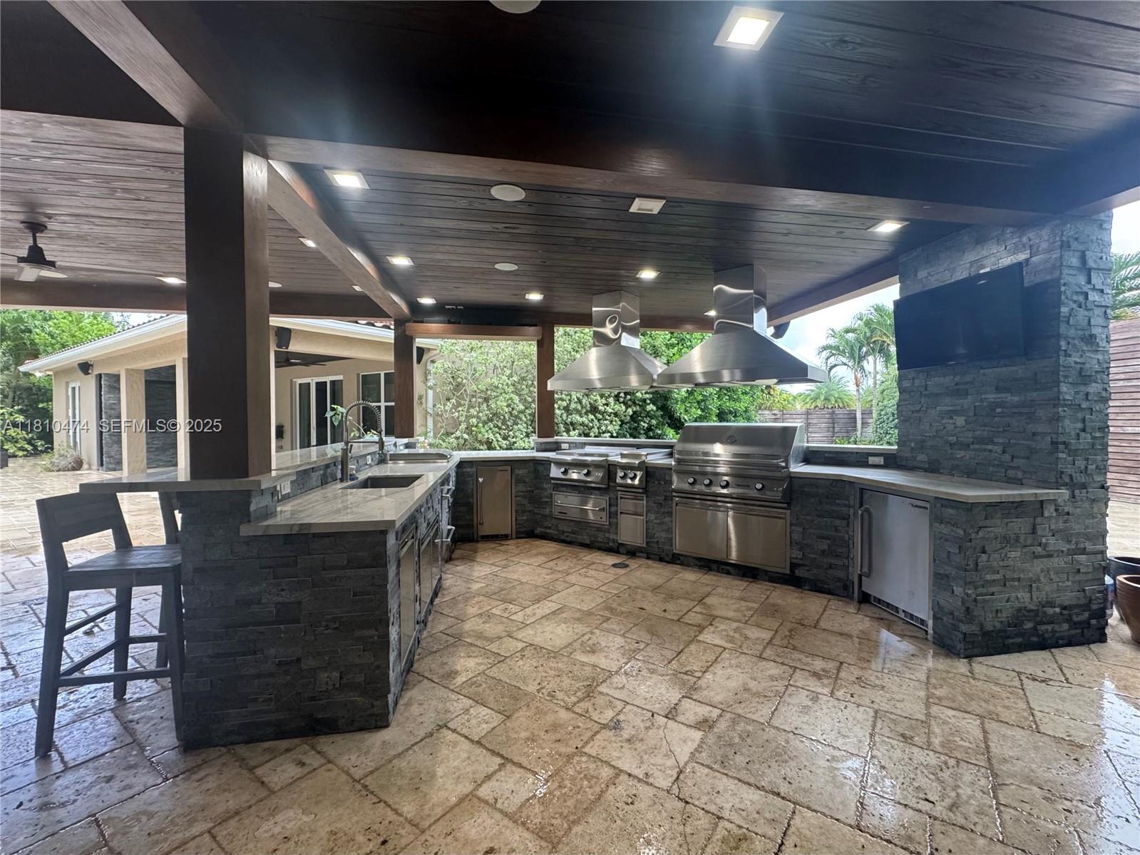 2230 Northwest 17th Avenue Homestead, FL 33030 - Photo 26 of 31 a kitchen with a stove and cabinets