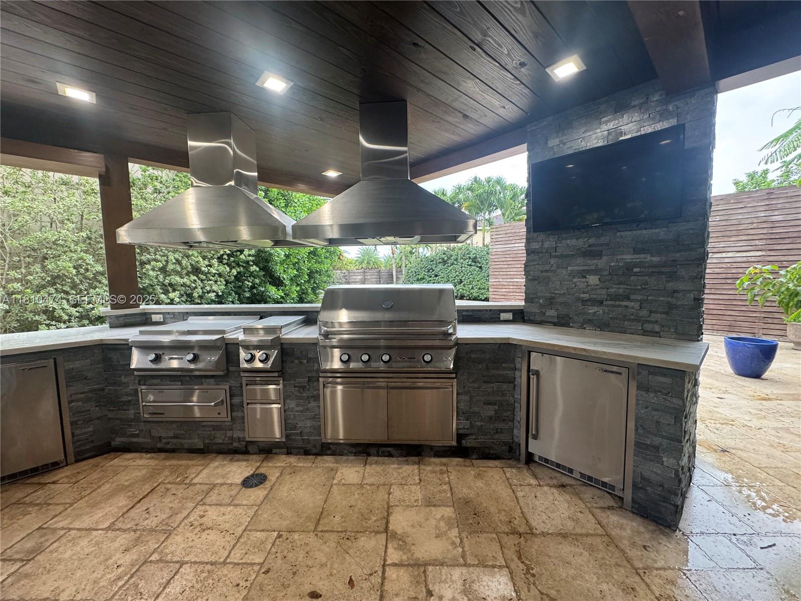 2230 Northwest 17th Avenue Homestead, FL 33030 - Photo 28 of 31 a kitchen with stainless steel appliances granite countertop a stove a sink and a microwave