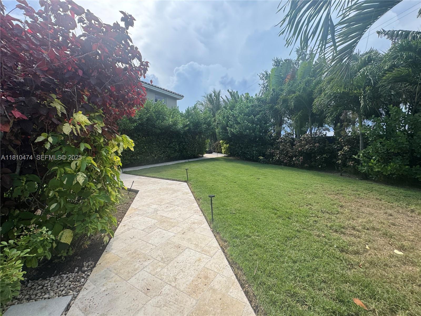 2230 Northwest 17th Avenue Homestead, FL 33030 - Photo 5 of 31 a view of a garden with a fountain