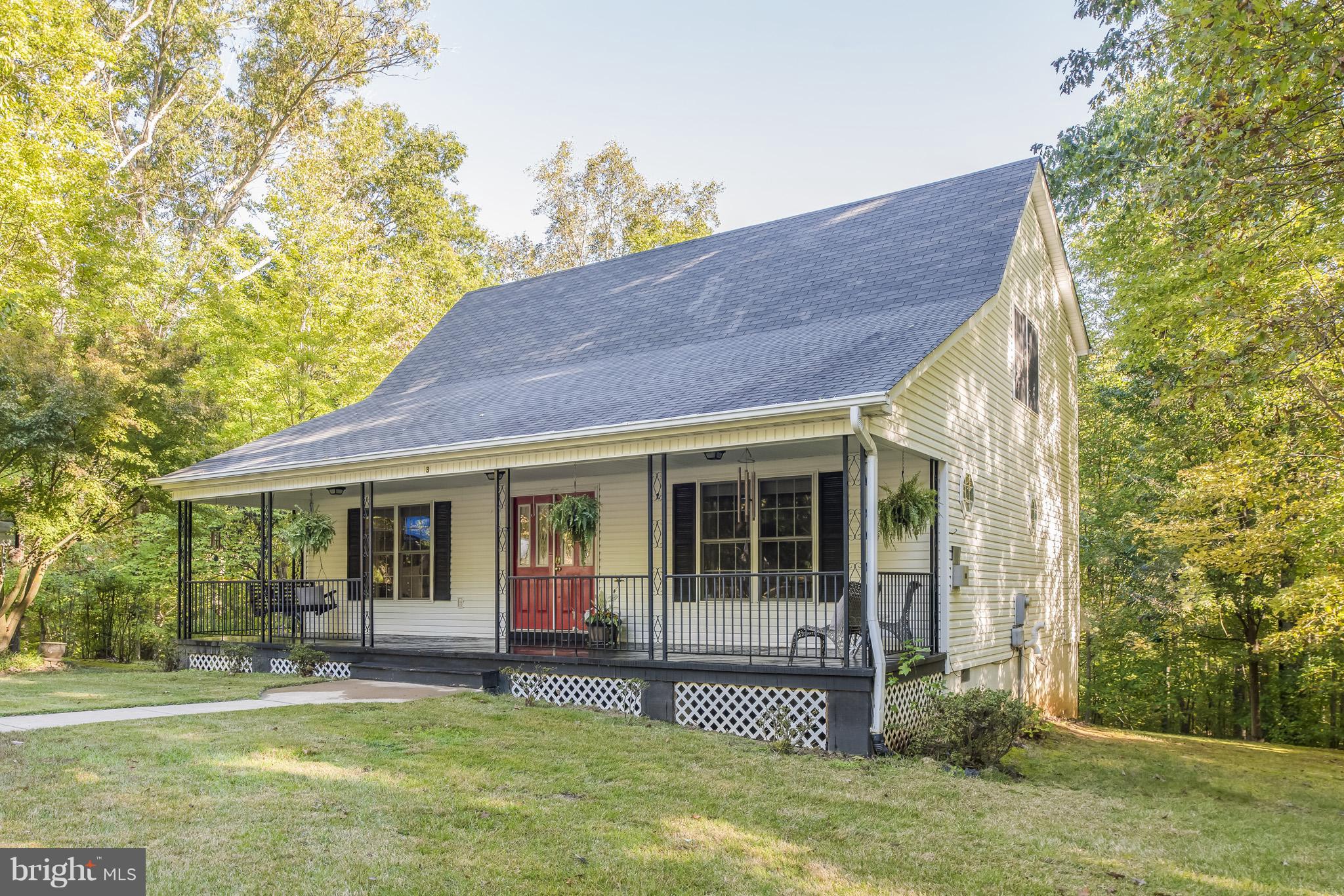 3 Ridgeview Circle Fredericksburg, VA 22406 - Photo 1 of 30 a view of a white house with a large window and yard