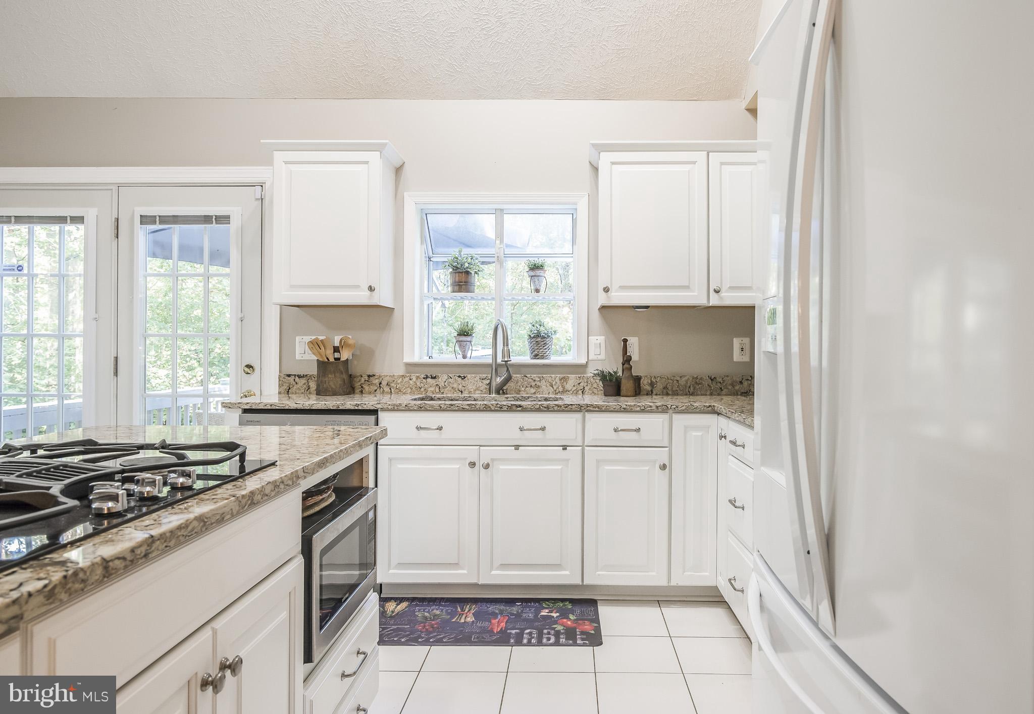 3 Ridgeview Circle Fredericksburg, VA 22406 - Photo 15 of 30 a kitchen with granite countertop a stove sink and cabinets