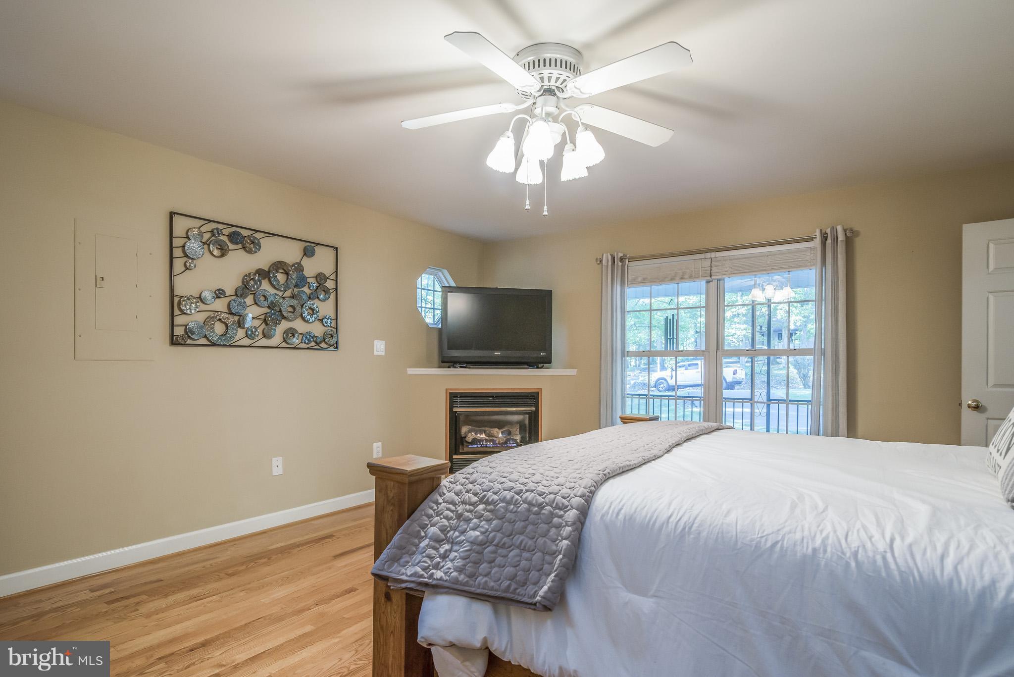 3 Ridgeview Circle Fredericksburg, VA 22406 - Photo 19 of 30 a spacious bedroom with a bed and a flat screen tv