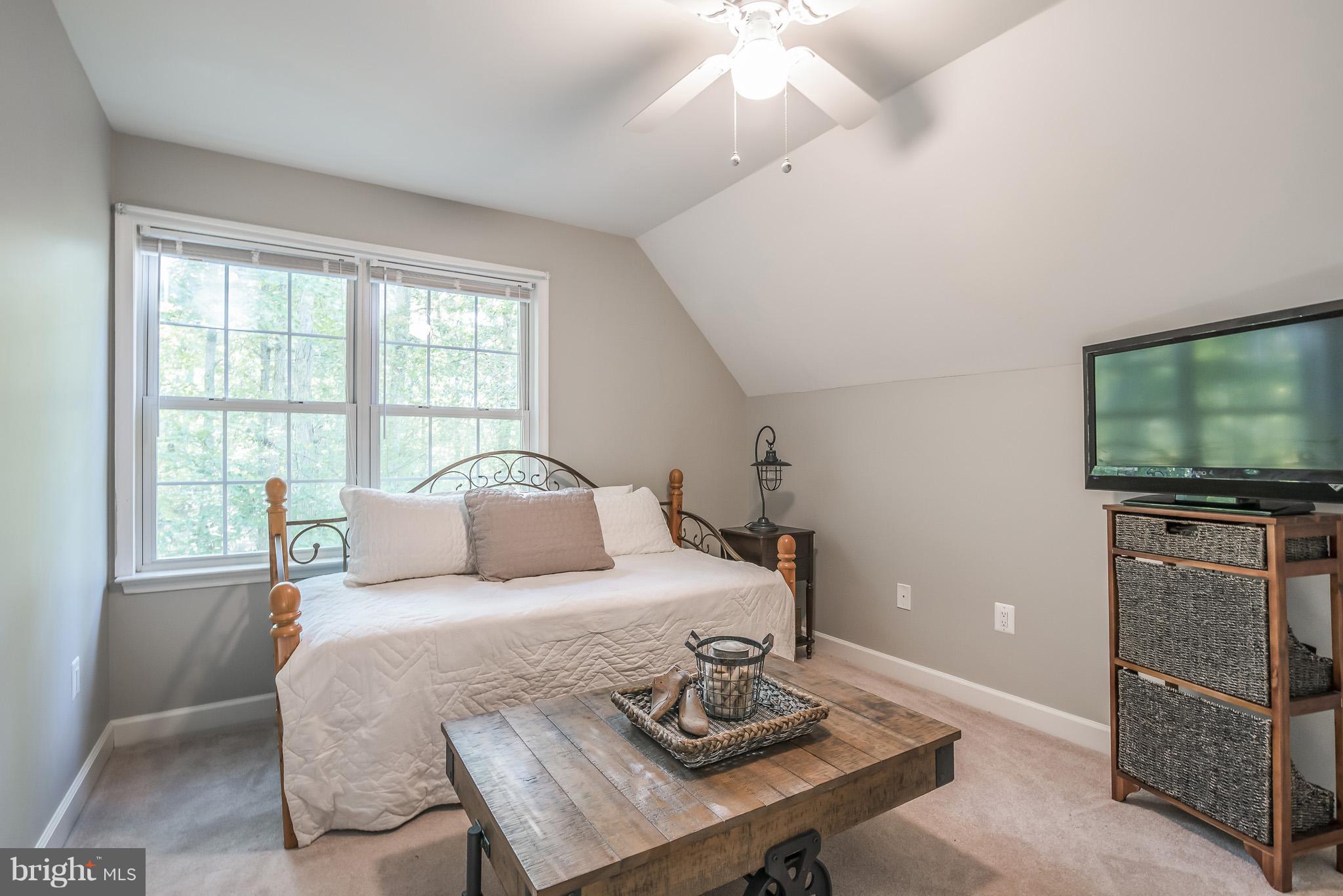 3 Ridgeview Circle Fredericksburg, VA 22406 - Photo 22 of 30 a bedroom with a bed and a flat screen tv