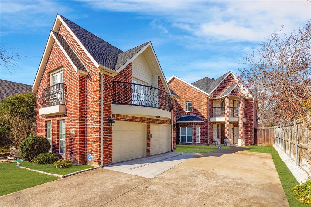 a view of a white house with a yard