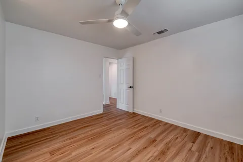 a view of room with wooden floor