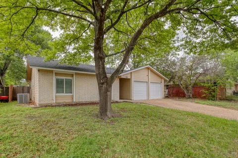 a house with a tree in front of it