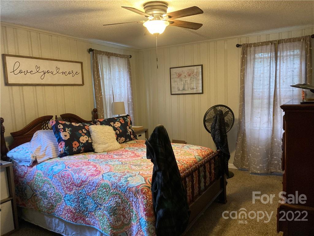 601 Sharpe Road Columbia, SC 29203 - Photo 23 of 32 a bedroom with bed and wooden floor