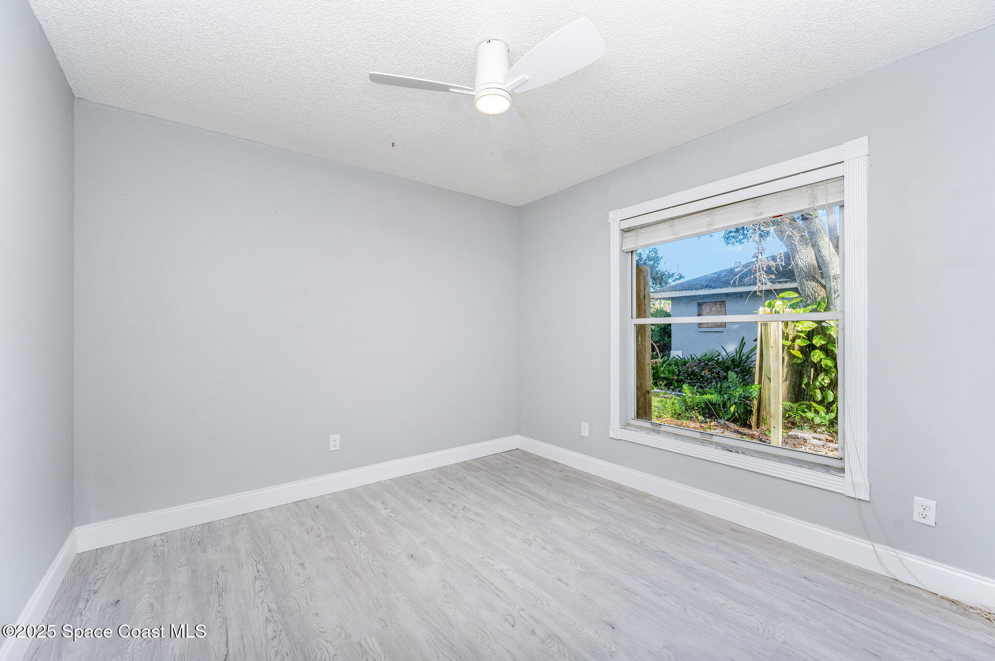 4285 Glover Street Cocoa, FL 32927 - Photo 18 of 25 an empty room with a window
