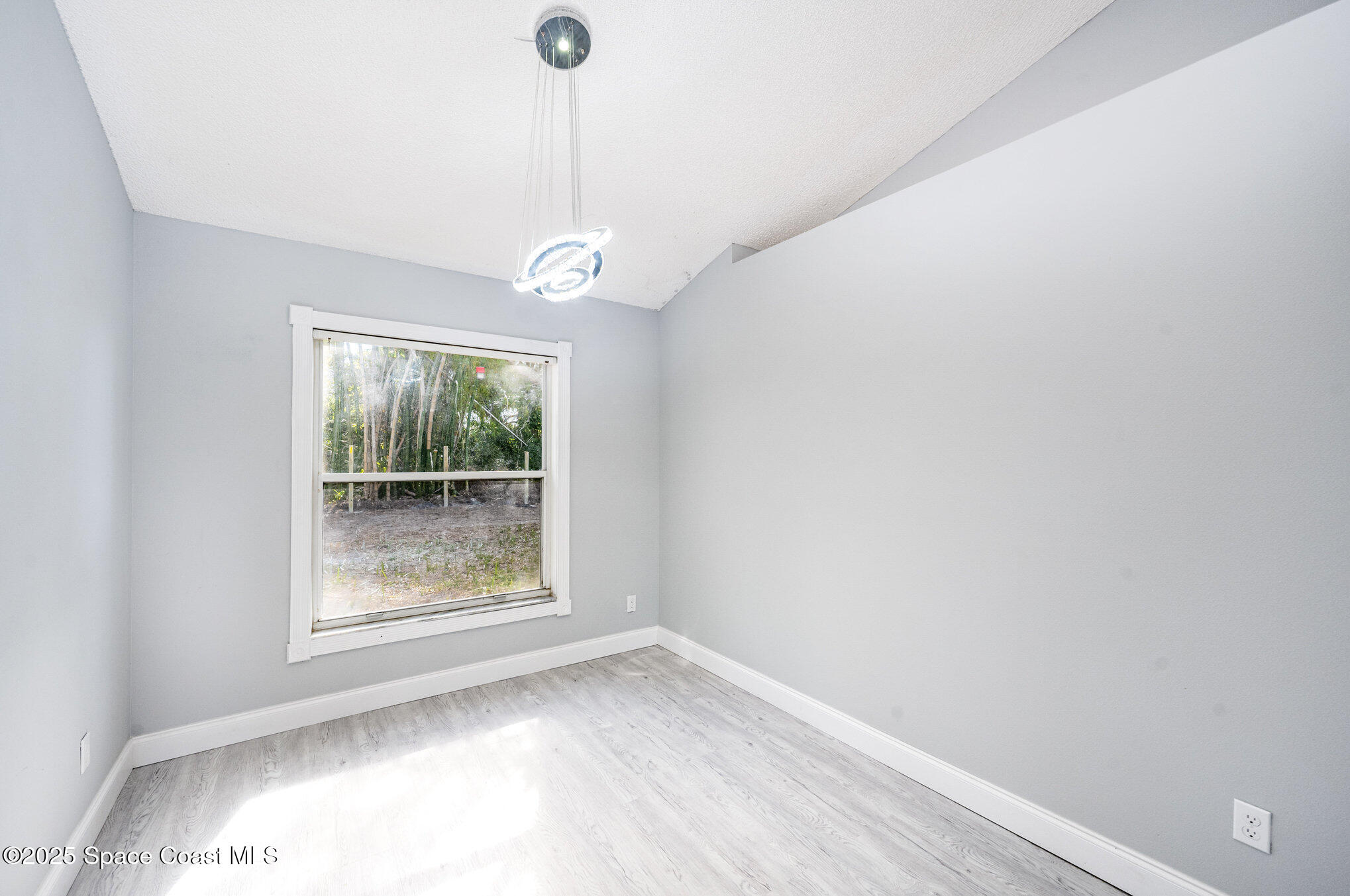 4285 Glover Street Cocoa, FL 32927 - Photo 5 of 25 a view of an empty room with a window