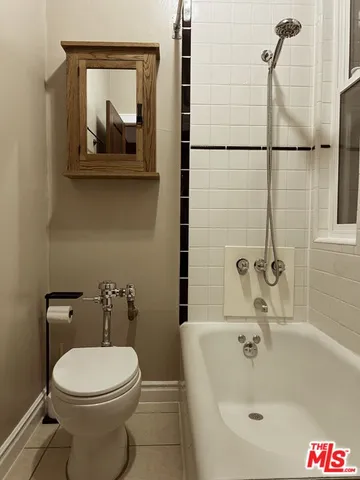 a bathroom with a toilet and a sink