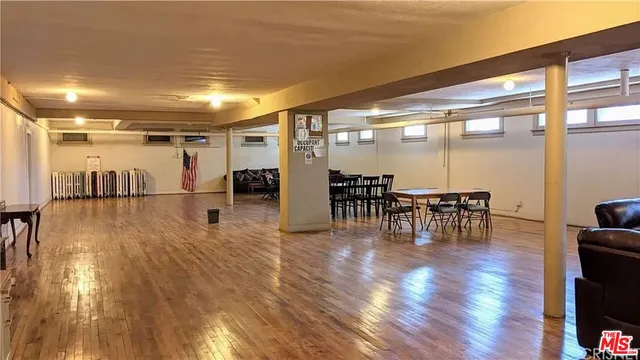 a lobby with furniture and wooden floor