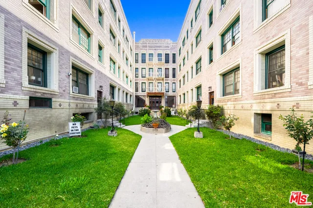 a view of an apartment with a garden and plants
