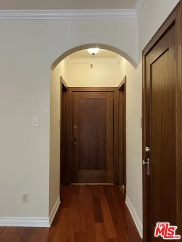 a view of entryway with wooden floor