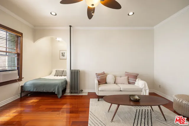 a living room with furniture and a window