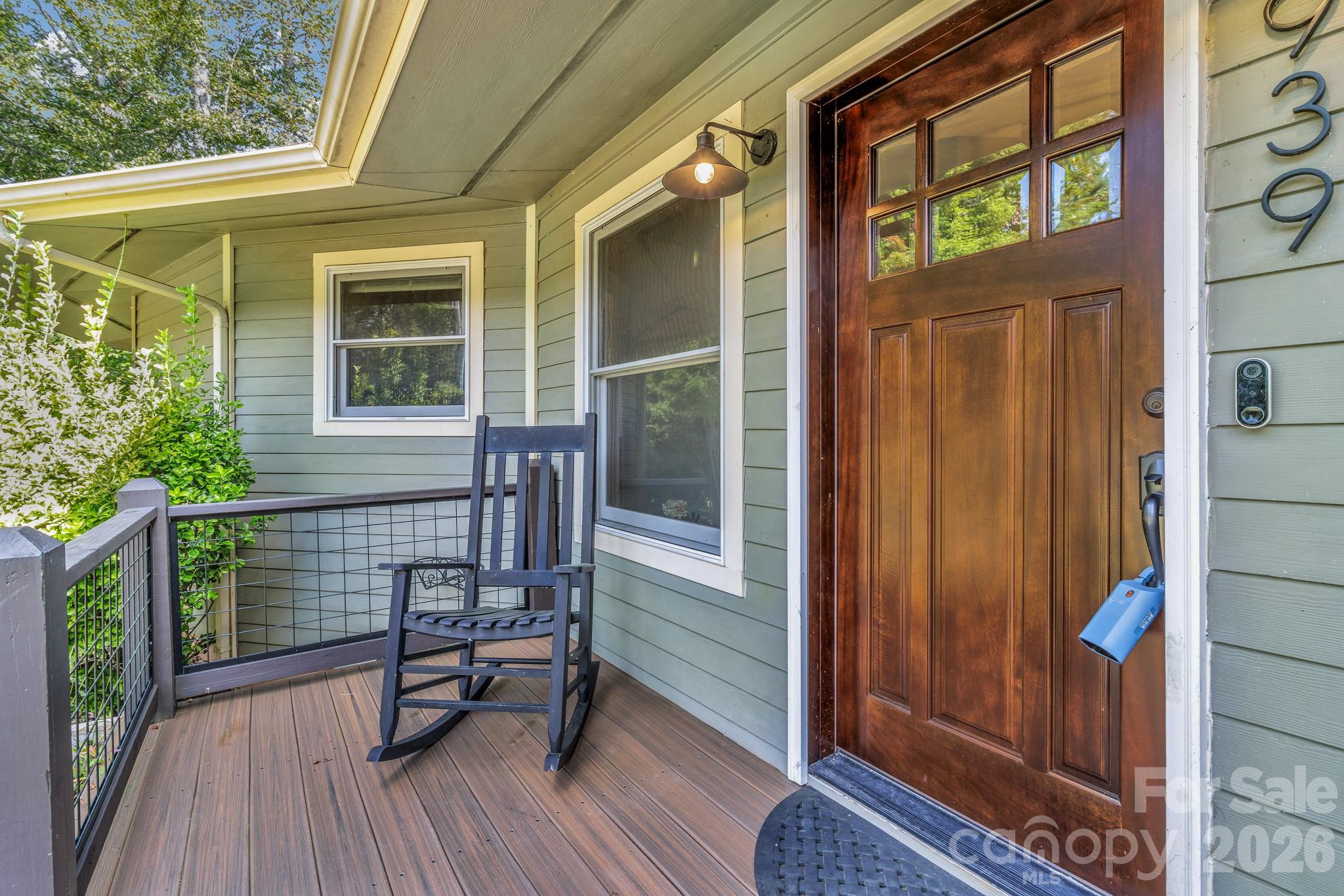a view of deck with a table and chairs and wooden floor