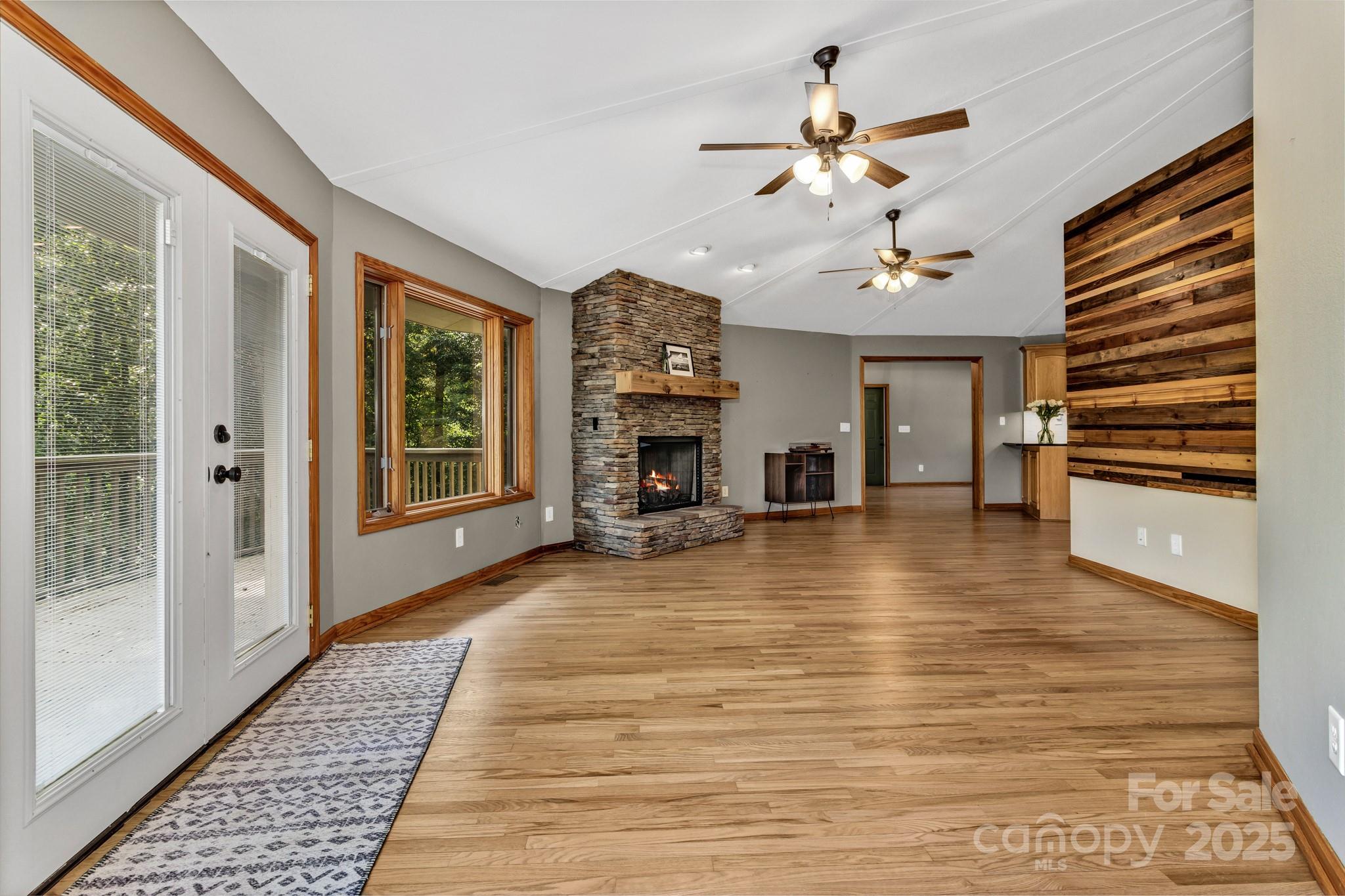 939 Morgan Hill Road Black Mountain, NC 28711 - Photo 15 of 48 a view of a livingroom with furniture fireplace workspace and windows
