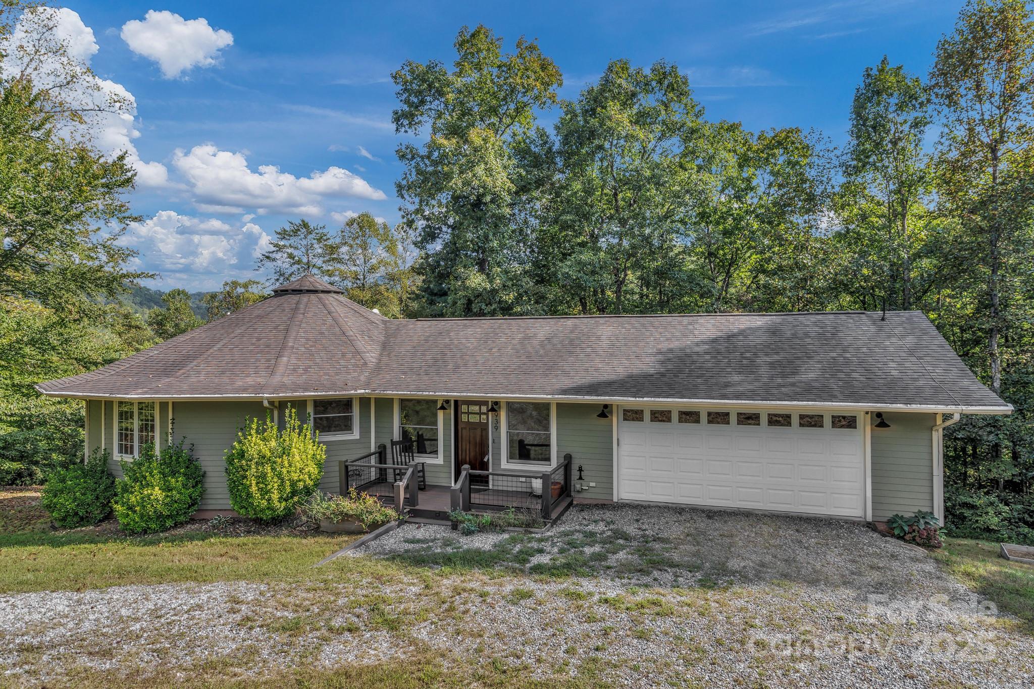 939 Morgan Hill Road Black Mountain, NC 28711 - Photo 23 of 48 a front view of a house with garden and porch