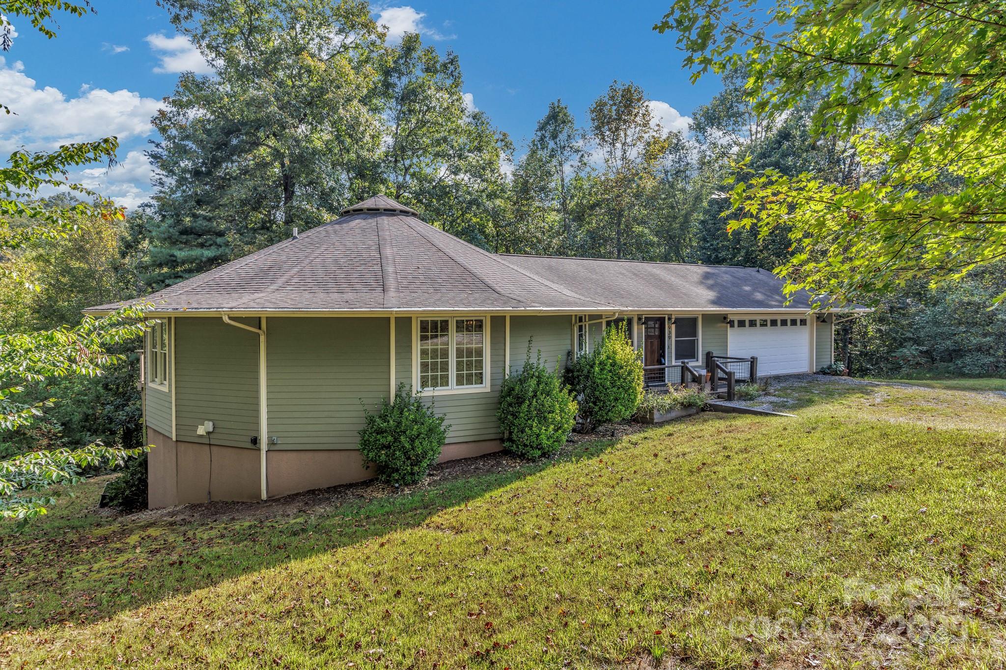 939 Morgan Hill Road Black Mountain, NC 28711 - Photo 24 of 48 a view of a house with garden and a trees