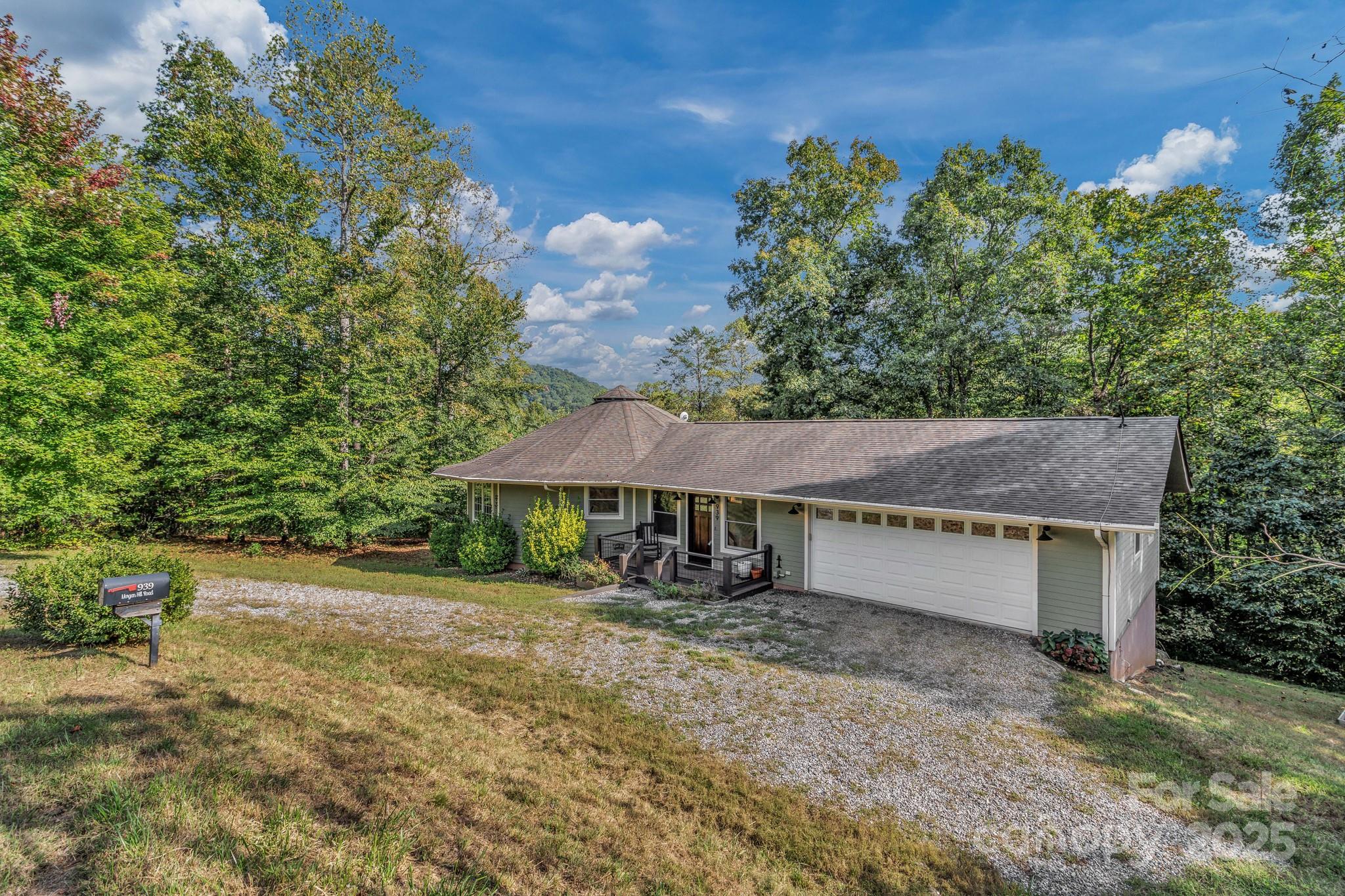 939 Morgan Hill Road Black Mountain, NC 28711 - Photo 25 of 48 a house with trees in the background