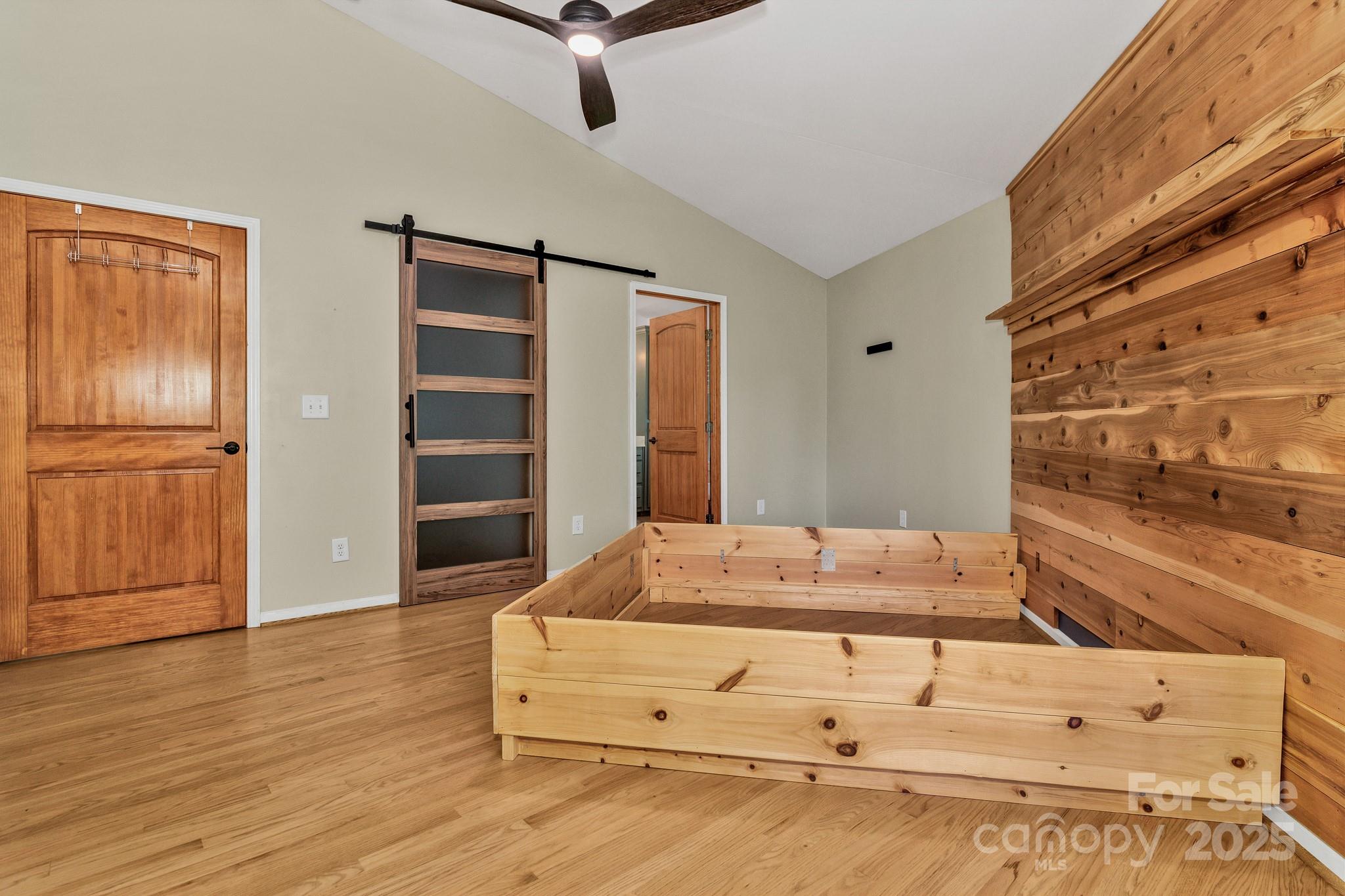 939 Morgan Hill Road Black Mountain, NC 28711 - Photo 35 of 48 a bedroom with a bed and a dresser