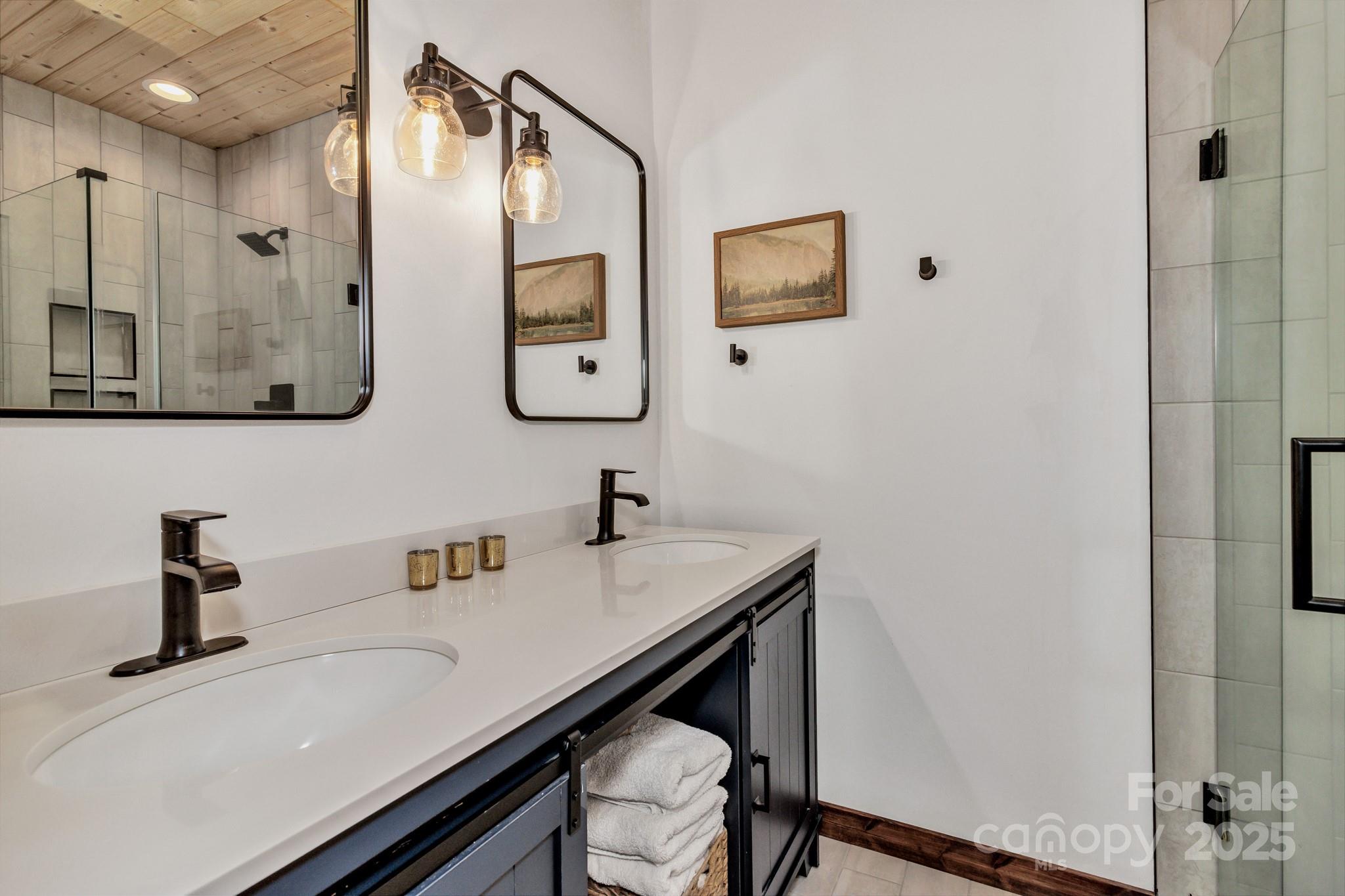 939 Morgan Hill Road Black Mountain, NC 28711 - Photo 38 of 48 a bathroom with a sink and a mirror