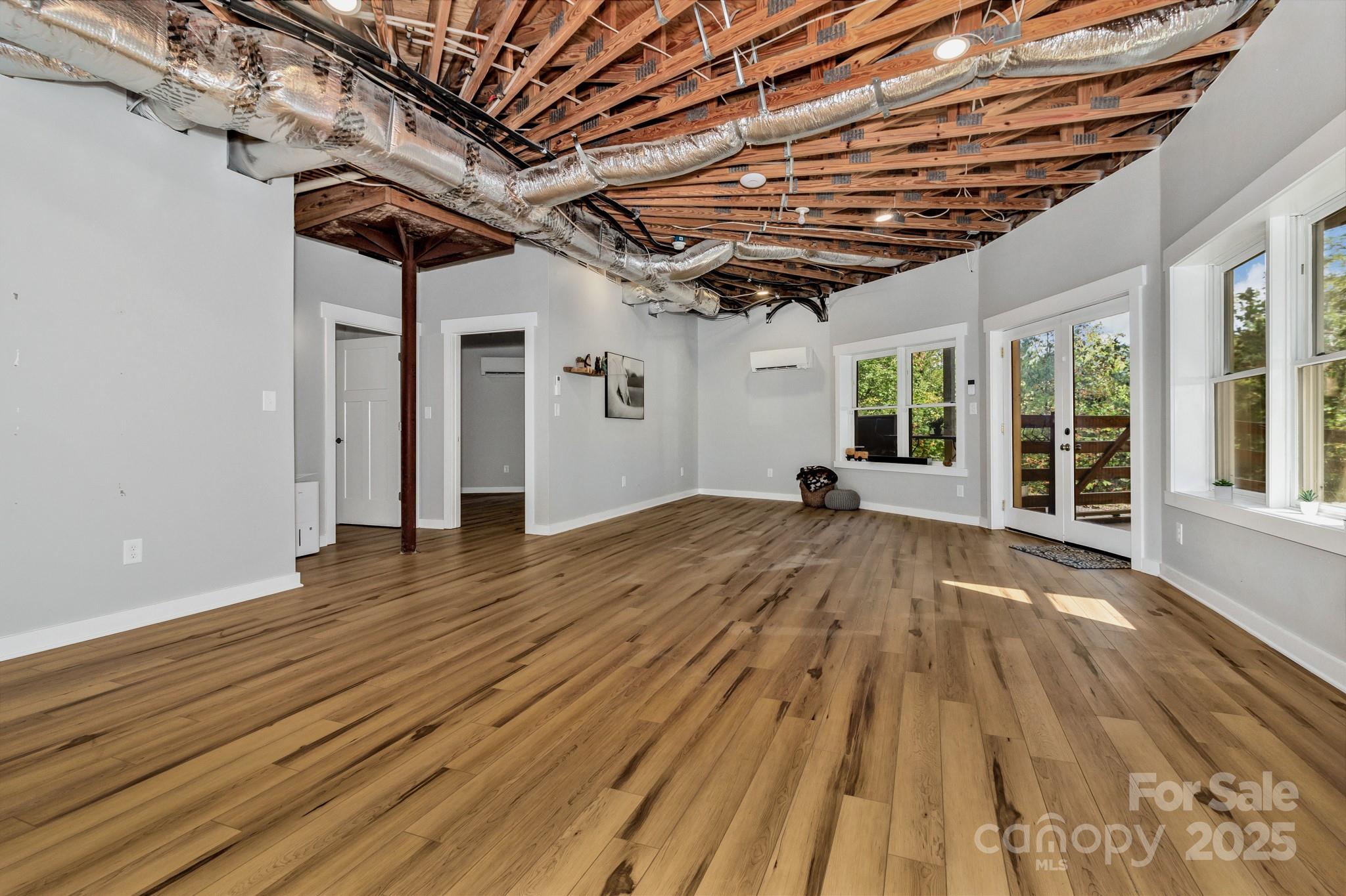 939 Morgan Hill Road Black Mountain, NC 28711 - Photo 42 of 48 a view of a room with wooden floor