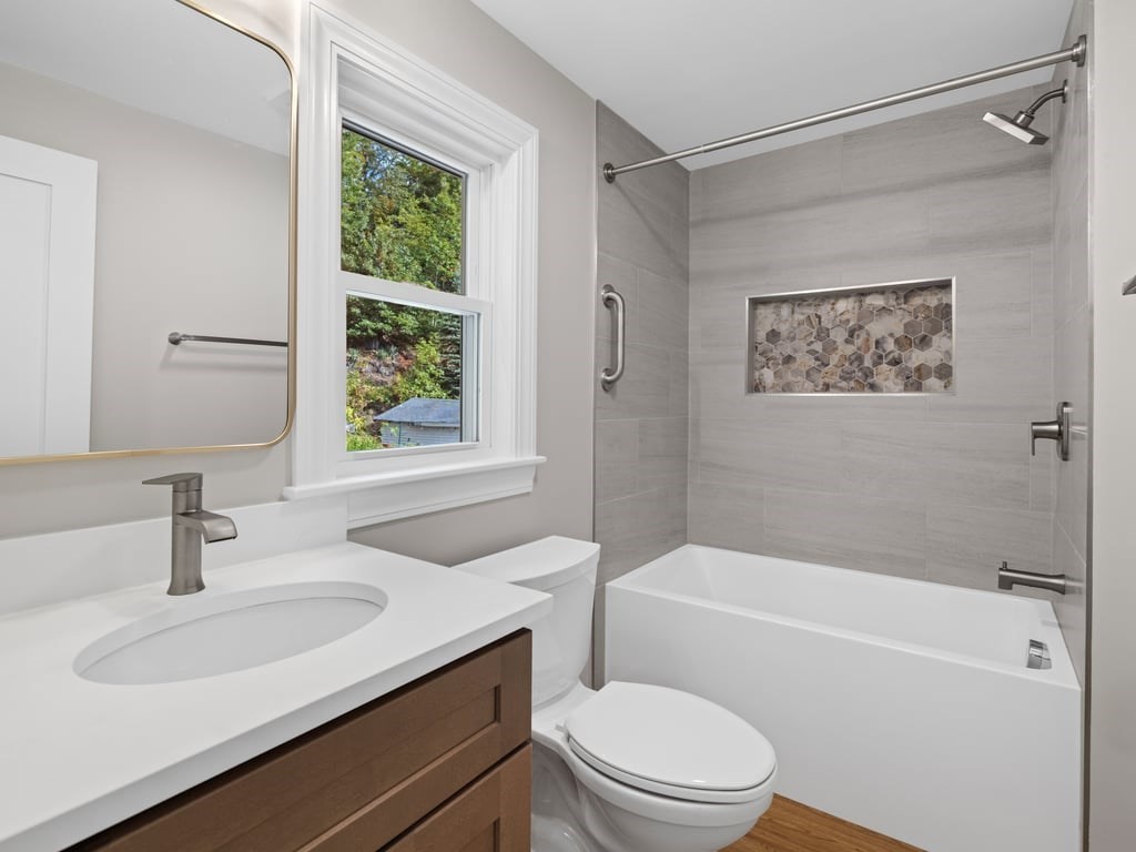 40 Cedar Street Wellesley, MA 02481 - Photo 13 of 23 a bathroom with a sink toilet and shower
