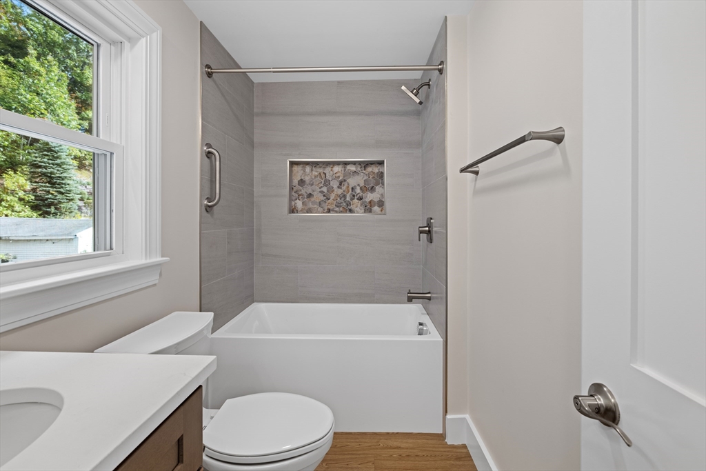 40 Cedar Street Wellesley, MA 02481 - Photo 14 of 23 a bathroom with a toilet and a shower