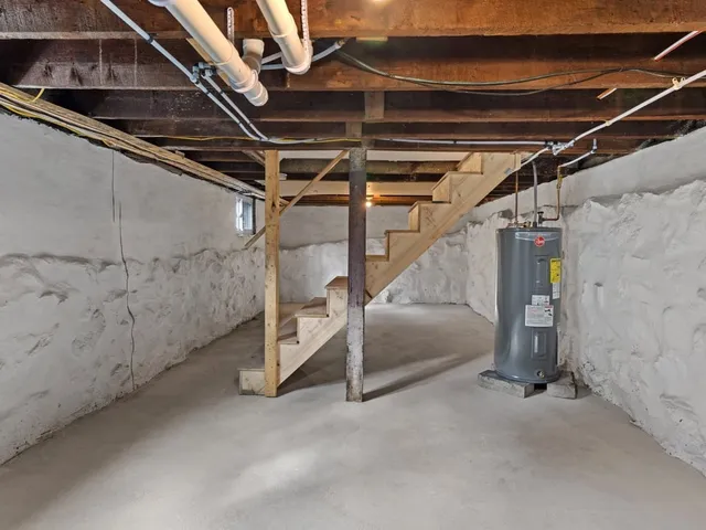 a view of an empty room with stairs