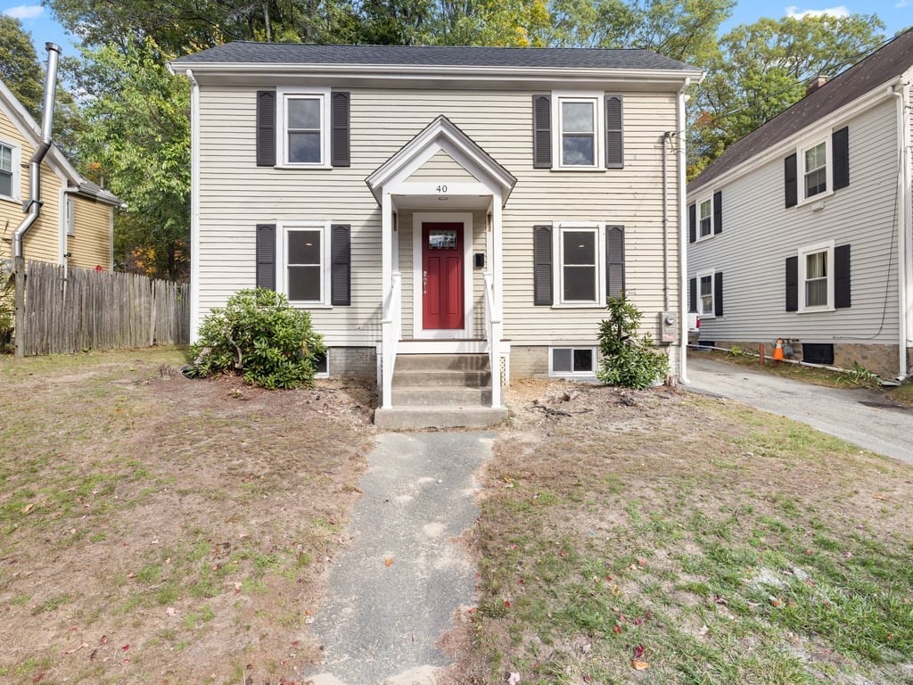 40 Cedar Street Wellesley, MA 02481 - Photo 22 of 23 a front view of a house with a yard