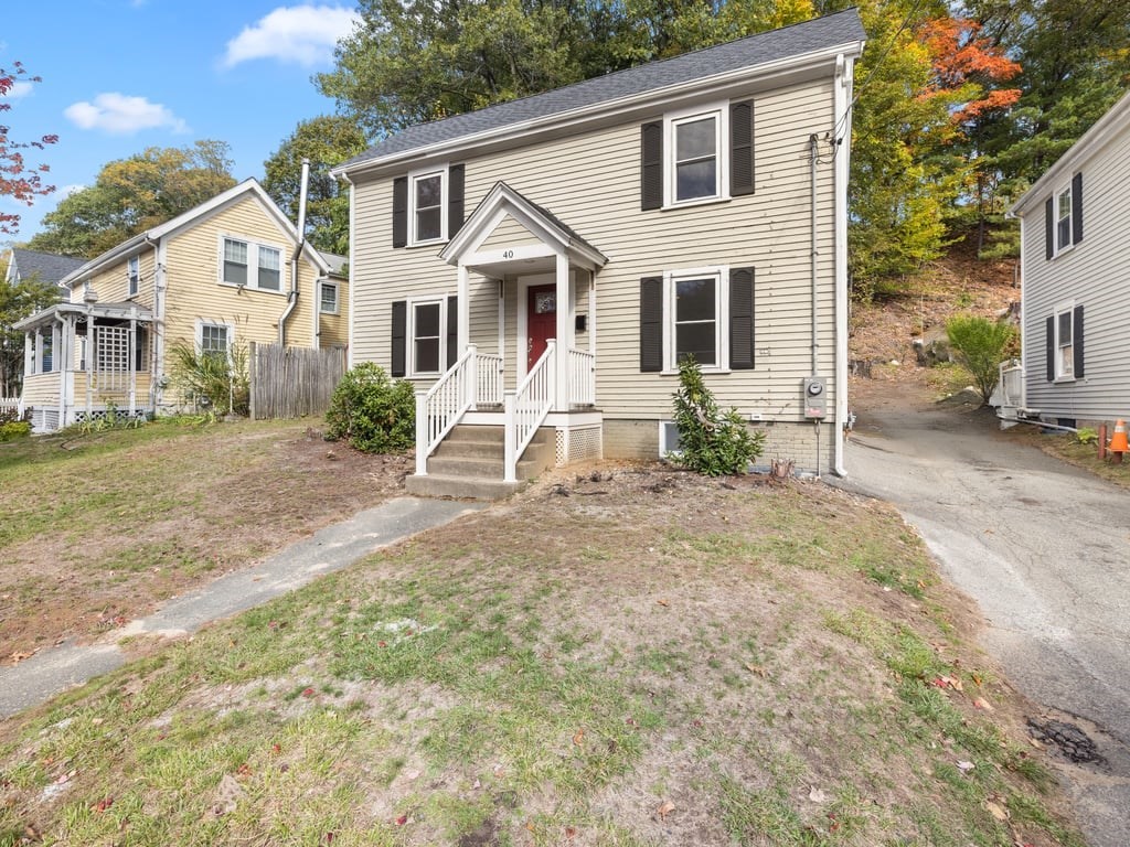 40 Cedar Street Wellesley, MA 02481 - Photo 23 of 23 a view of a house with a yard and porch