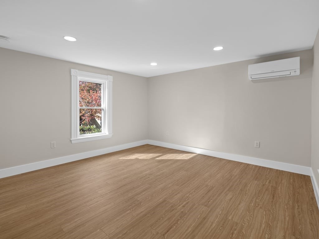 40 Cedar Street Wellesley, MA 02481 - Photo 10 of 23 a view of empty room with wooden floor and fan