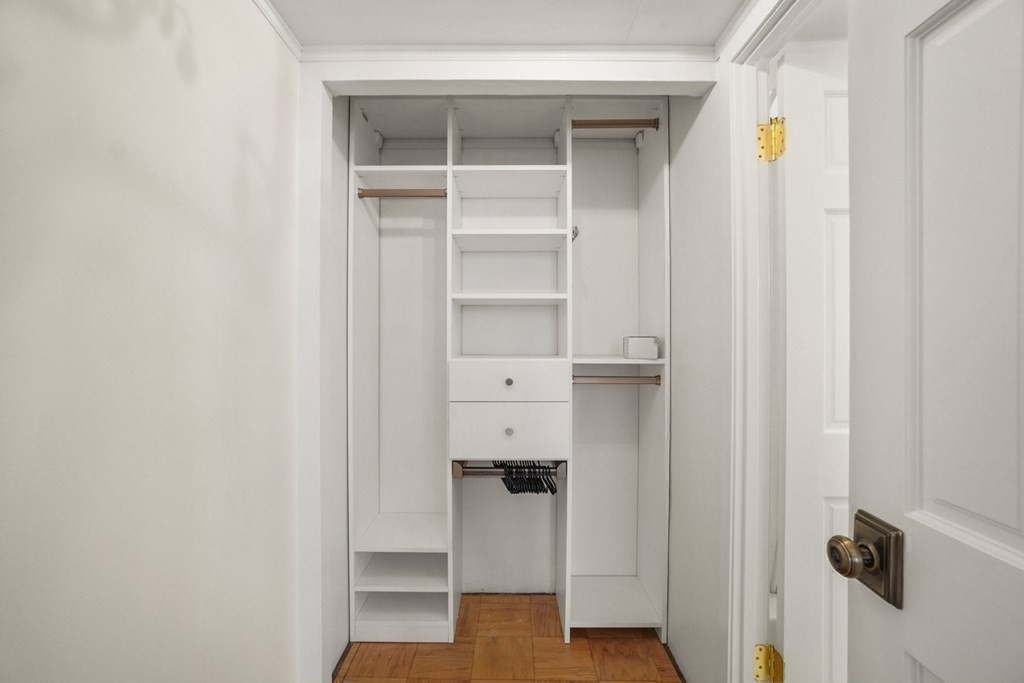 27 Bowdoin Street, Unit 1C Boston, MA 02114 - Photo 6 of 16 a view of walk in closet with empty racks