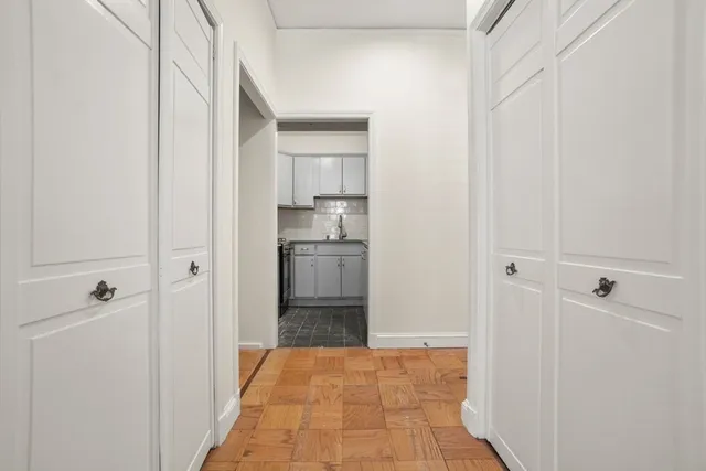 a view of a kitchen from the hallway