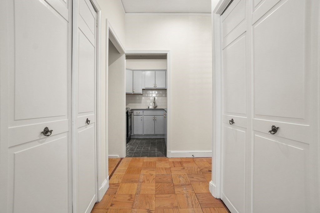 27 Bowdoin Street, Unit 1C Boston, MA 02114 - Photo 8 of 16 a view of a kitchen from the hallway