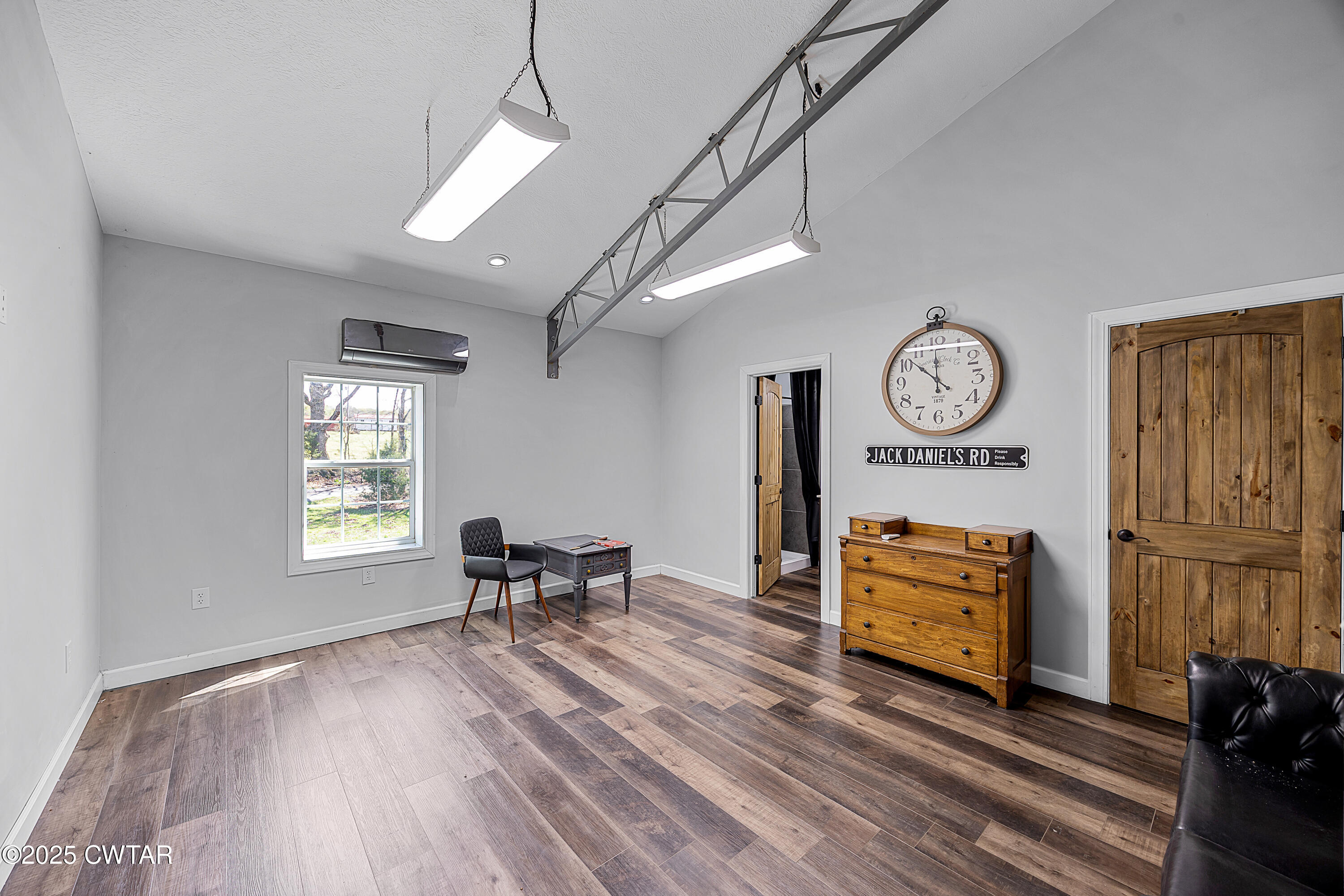 90 Dawson Bottom Road Humboldt, TN 38343 - Photo 15 of 24 a view of a workspace with furniture and a window