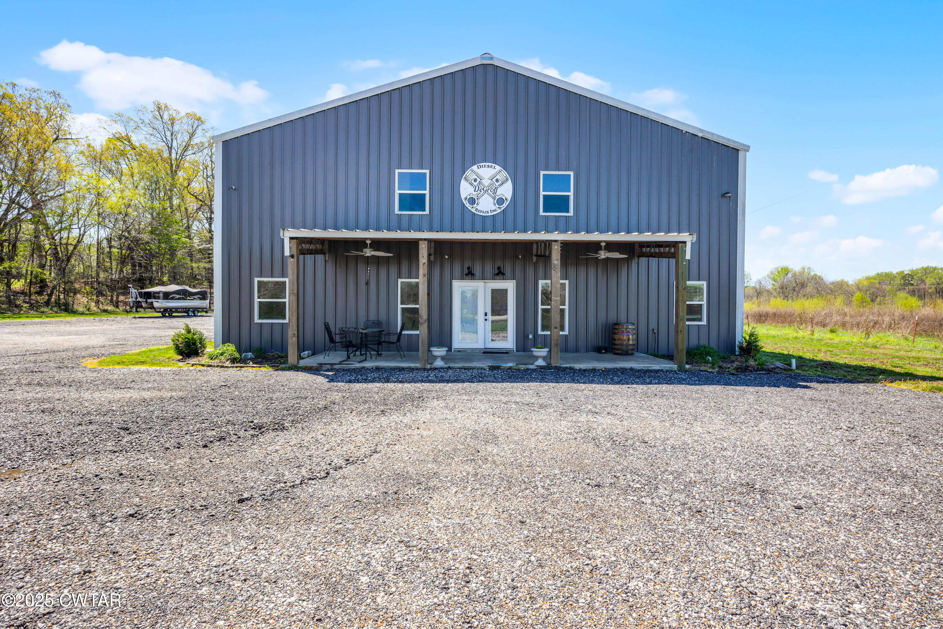 90 Dawson Bottom Road Humboldt, TN 38343 - Photo 4 of 24 a view of a house with backyard and porch