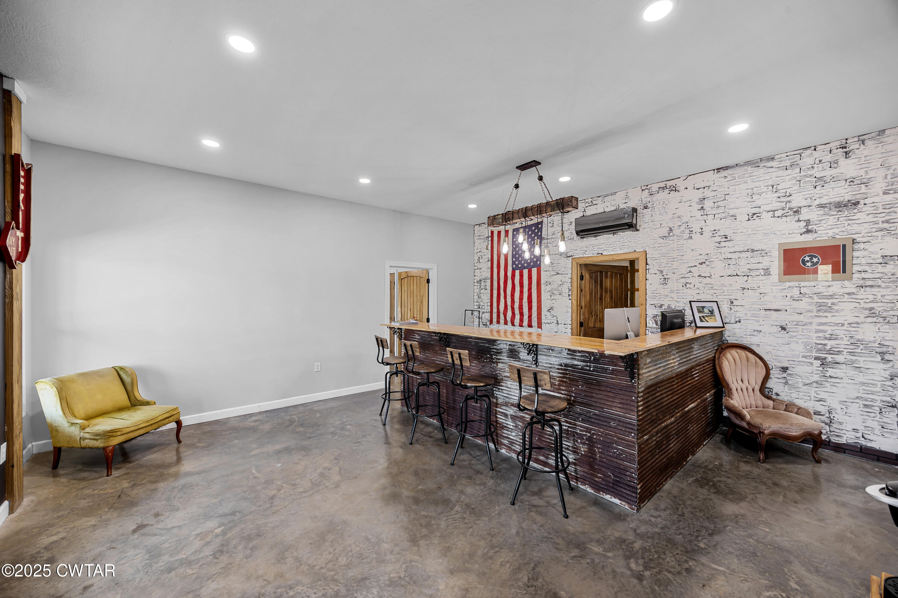 90 Dawson Bottom Road Humboldt, TN 38343 - Photo 6 of 24 a view of a workspace with furniture