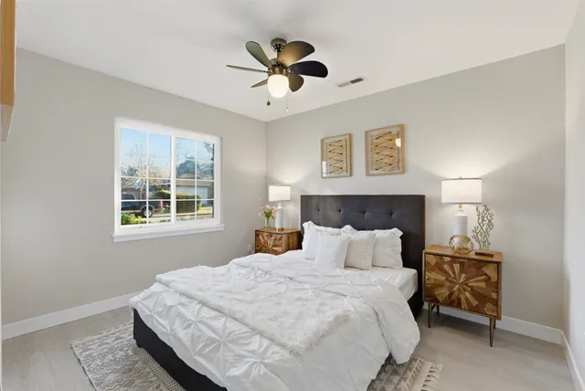 a bedroom with a bed and window